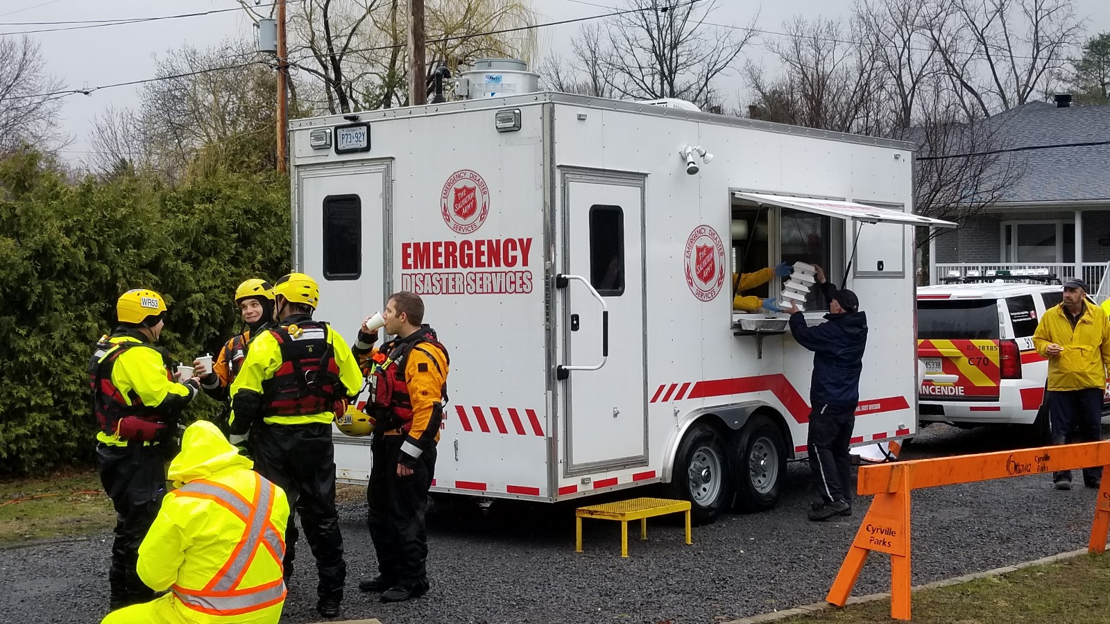 EDS workers being served by a Salvation Army trailer