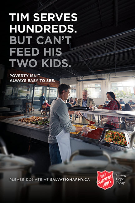 Salvation Army Canada winter 2018 2019 campaign ad. Tim, a cafeteria worker, is serving meals to customers. The ad reads: Tim serves hundreds. But can't feed his two kids. Poverty isn't always easy to see. Please donate at salvation army dot c a. The Salvation Army. Giving hope today.