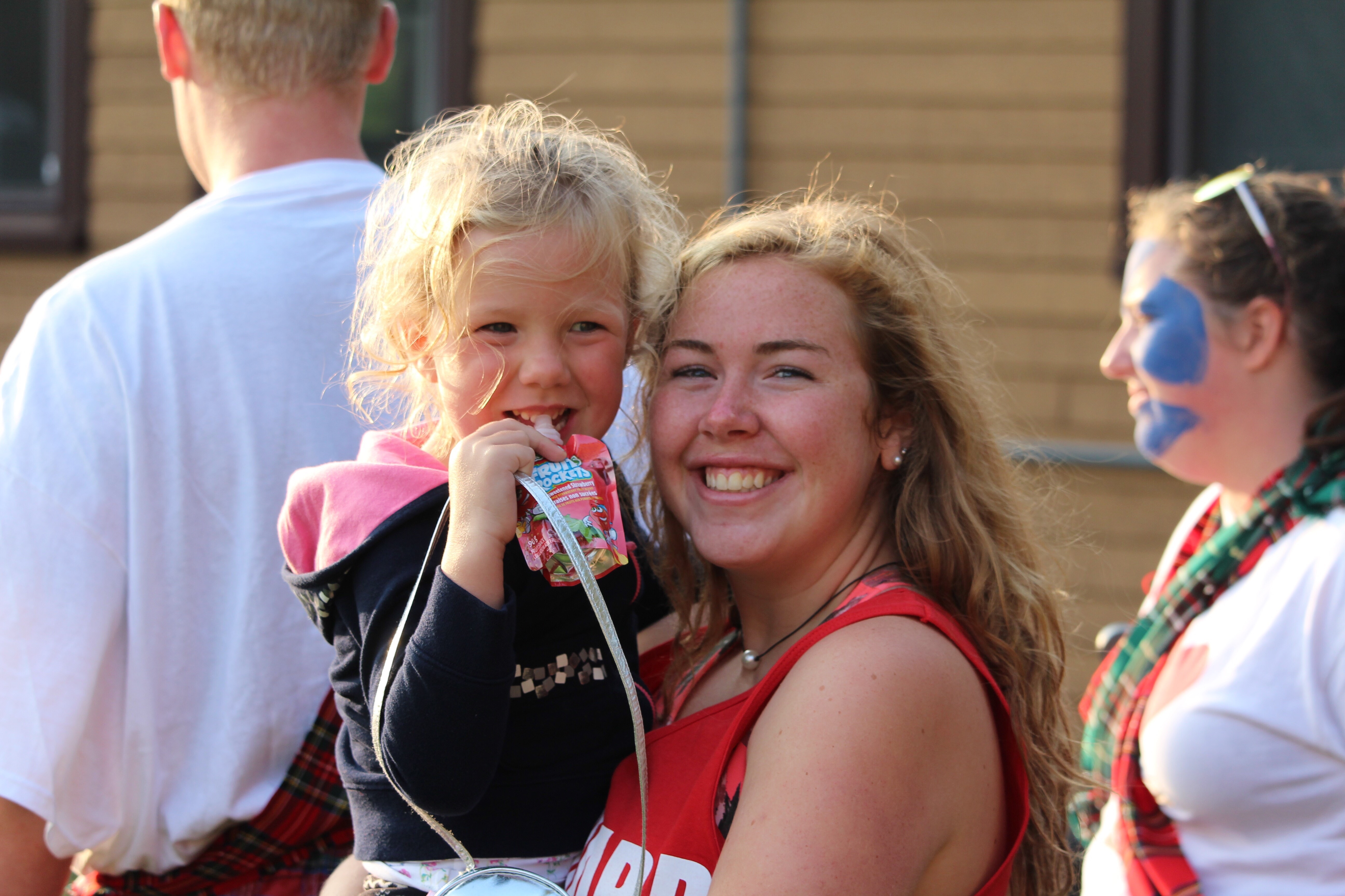 Micaela holds camper