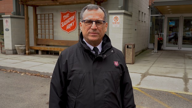 Commissioner Floyd J. Tidd stands in front of Meighen Health Centre