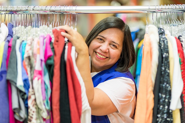 Salvation Army workers sorts clothes at thrift store