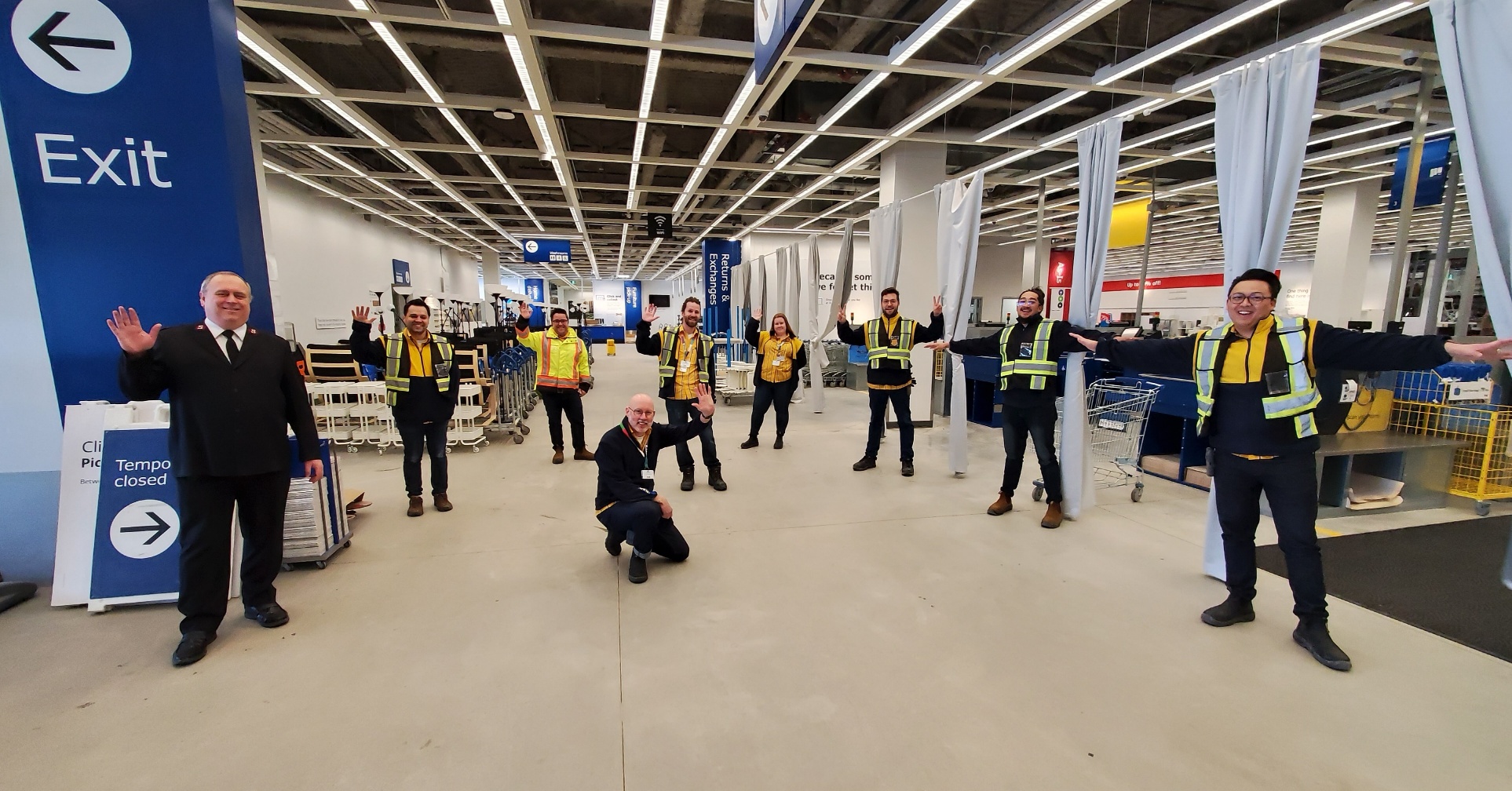 Major Gordon Taylor (left) poses with IKEA Winnipeg employees after all trucks were loaded and enroute to The Salvation Army Winnipeg Centre of Hope. Note they are following social distancing guidelines.