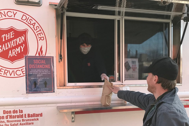 Salvation Army St. John emergency disaster services vehicle feeds local shelter residents