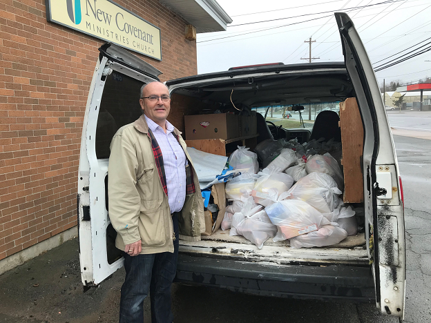 Volunteer delivers food in van to vulnerable people