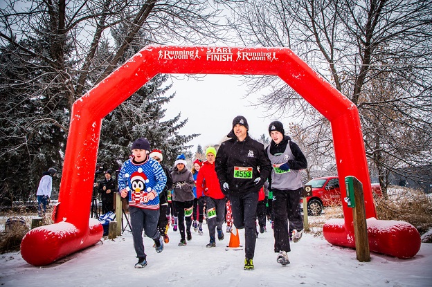 Santa Shuffle participants cross the finish line