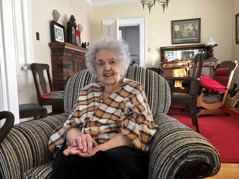 Faye, longtime donor, sits in her big comfy chair