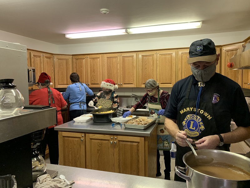 Volunteers prepare food for community cafe