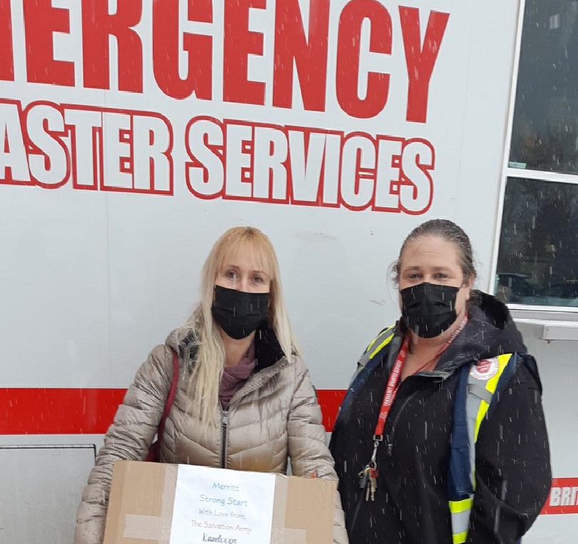 Ewa receives a box of supplies for her children's program from The Salvation Army