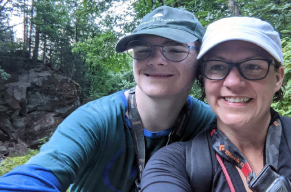 Jordan left and Kelley right outdoors wearing ball caps