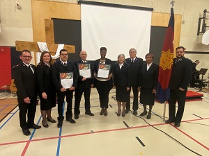 Spencer (fourth from left) becomes a member of The Salvation Army