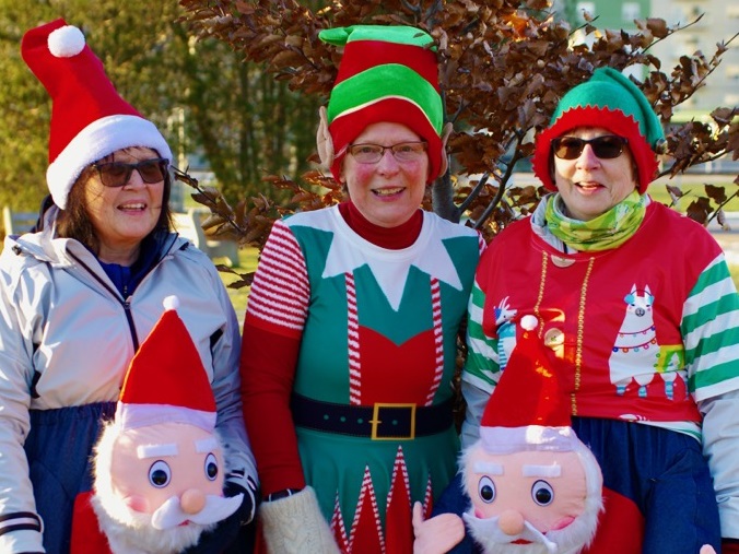 three participants in festive gear