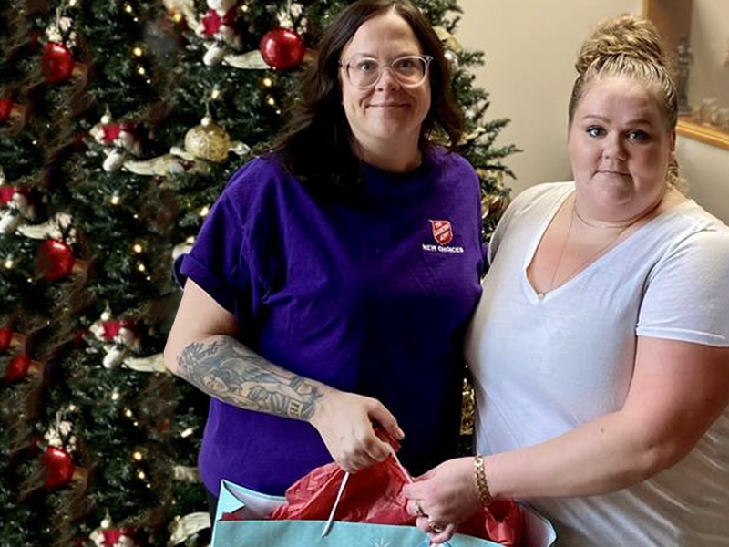 Salvation Army worker gives Alysse toys for under the tree