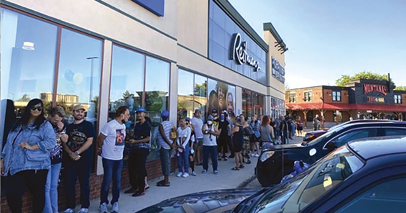 More than 200 shoppers line up to visit the Empress Thrift Store in Winnipeg during its grand reopening event in September 2022