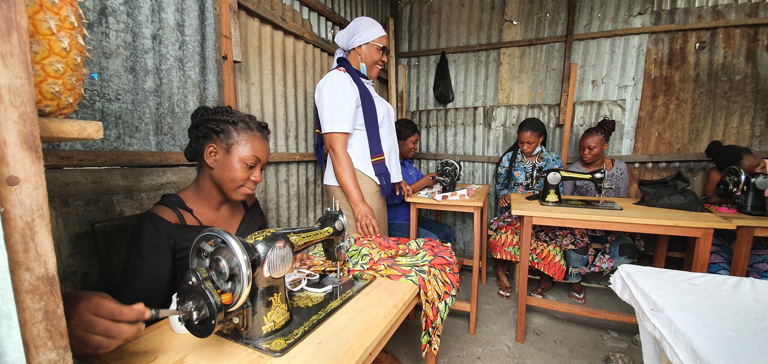ladies performing sewing training
