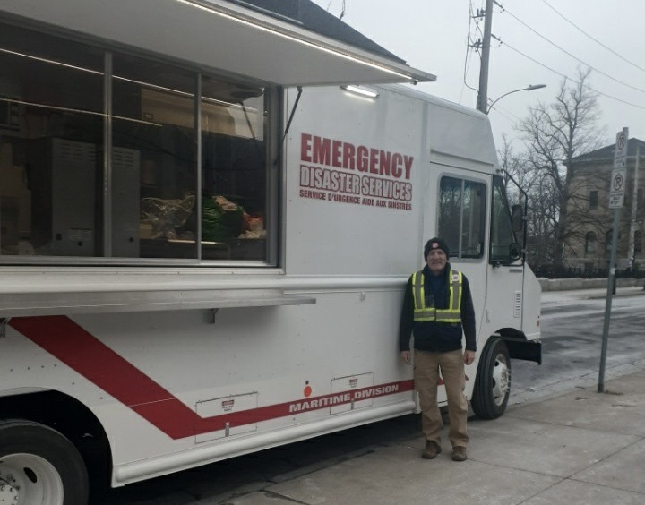 Tom stands in front of mobile feeding unit