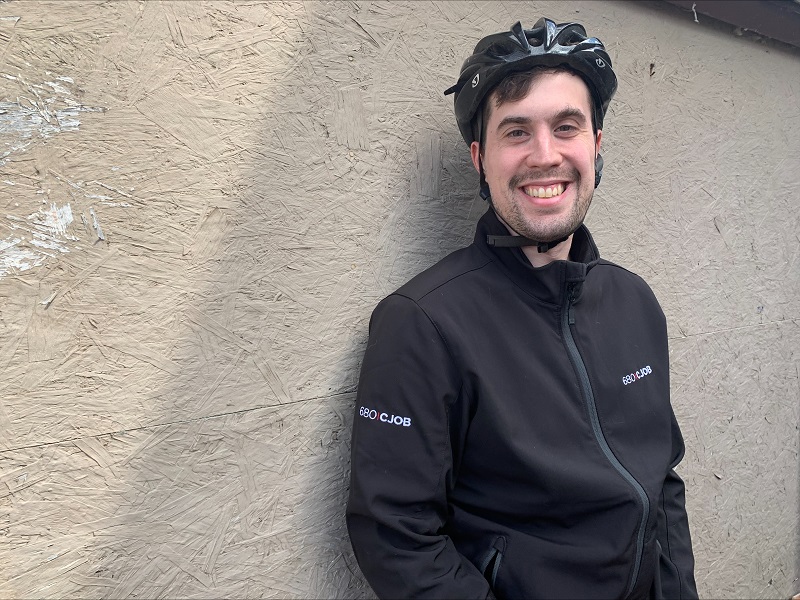 Chris with bike helmet and 680 CJOB jacket
