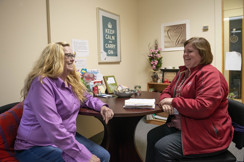 Staff speaks with client at the Calgary Barbara Mitchell Family Resource Centre