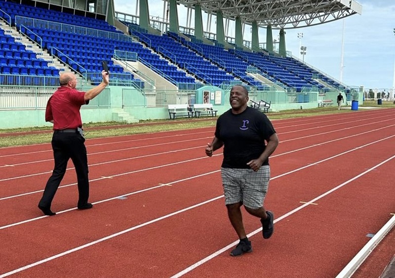 Black male runs on track