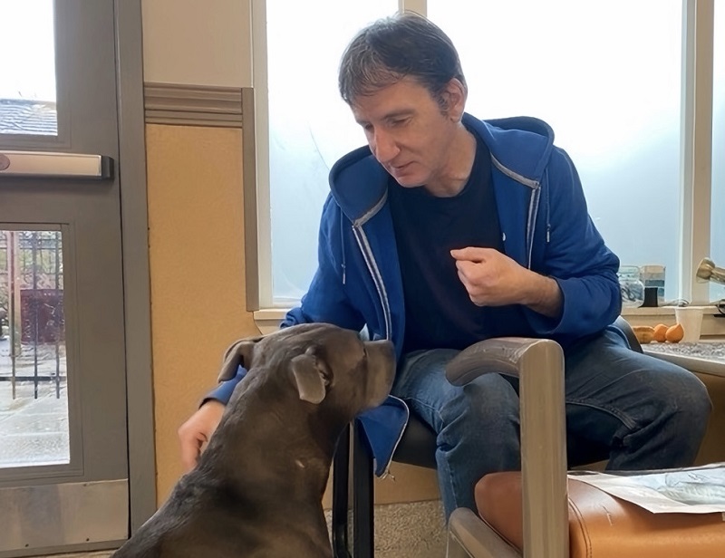Shelter guest with pet dog