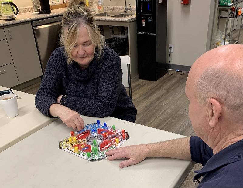 male and female play a board game