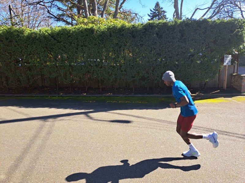 Joshua running on pavement in warm temperatures