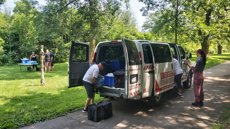 EDS van in park with supplies for vulnerable