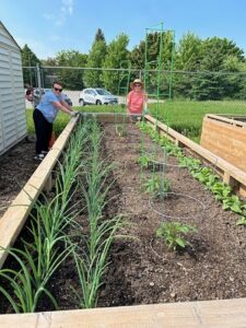 Community garden participants work to fight food insecurity