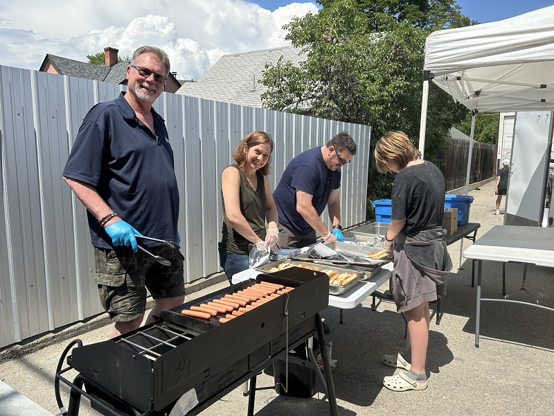 Ward and team serving hot dogs