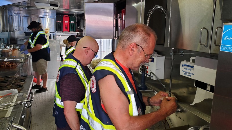 EDS workers in mobile van prepare food and hydration