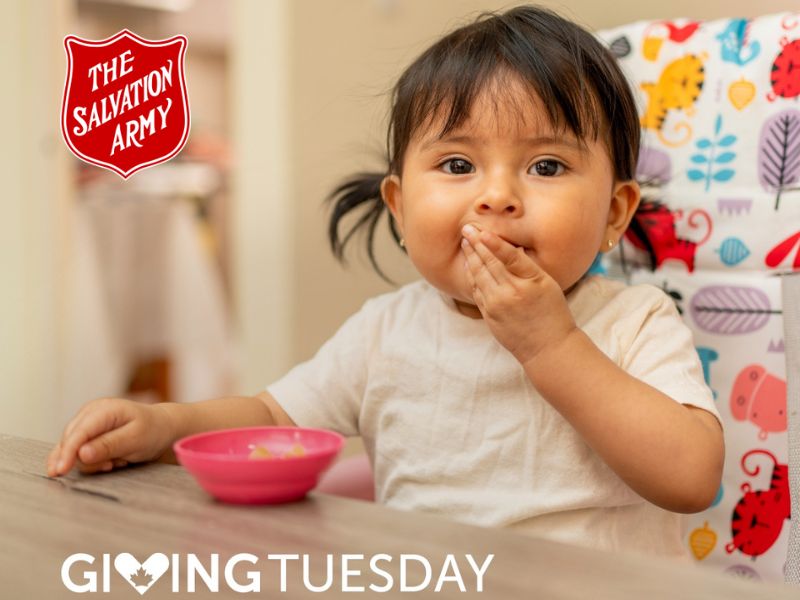 Little girl eating food out of a bowl