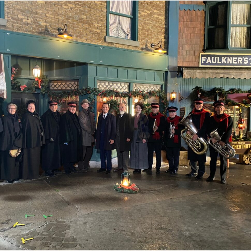 Members of the Canadian Staff Songsters and Staff Band with the stars of the Murdoch Mysteries Christmas special