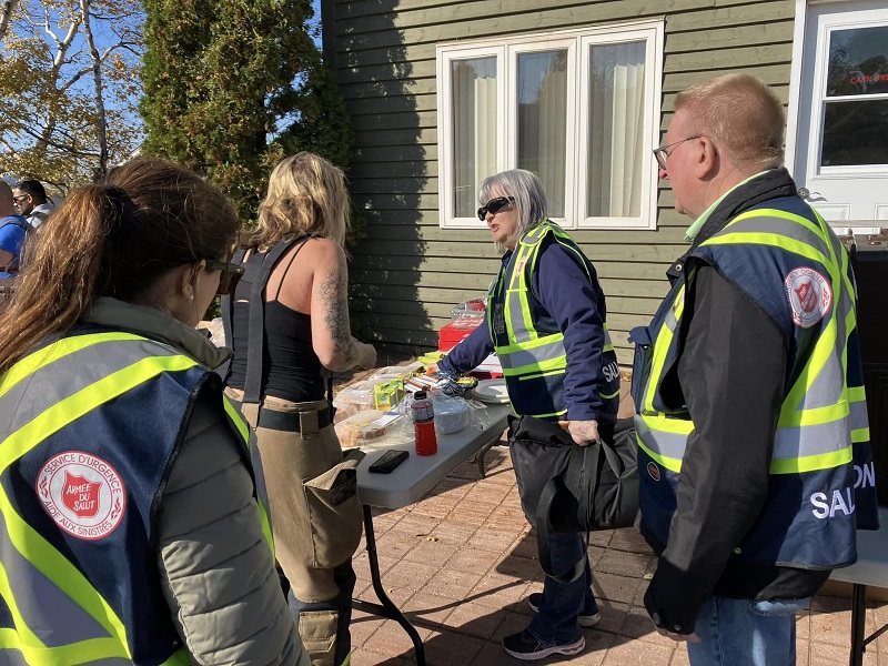 EDS workers provide food and hydration to survivors of fire