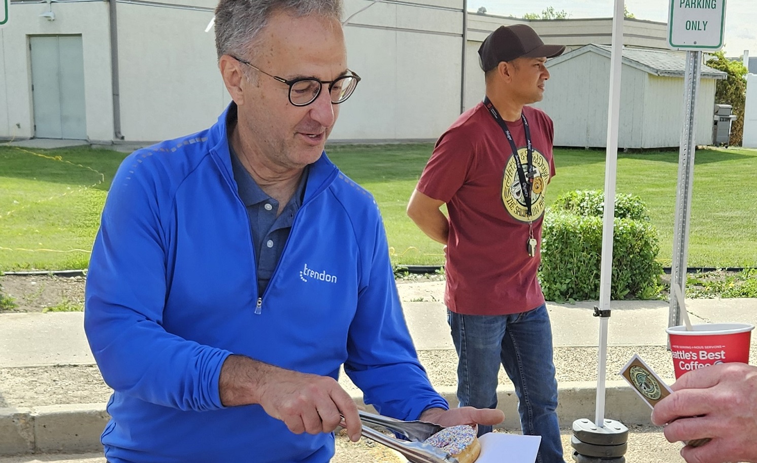 NAB member serves doughnuts