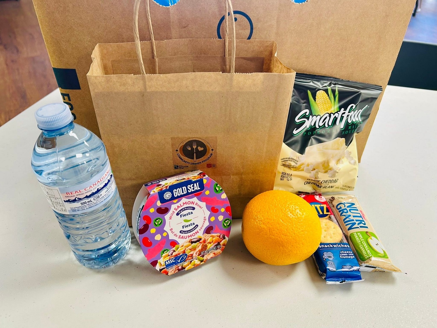 lunch bags include water, fruit, snacks and protein