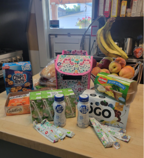 lunchbox with snacks beside it